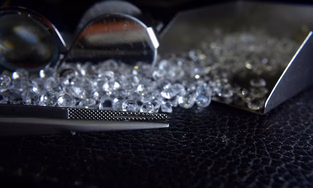 Pile of rough diamonds in a hand